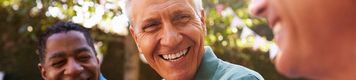 Mature male friends chatting outdoors