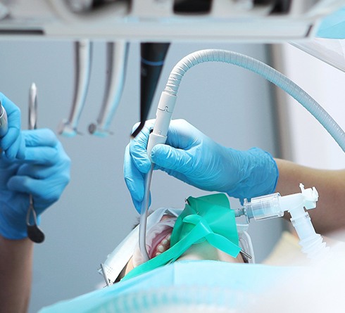 Patient undergoing oral surgery while under general anesthesia