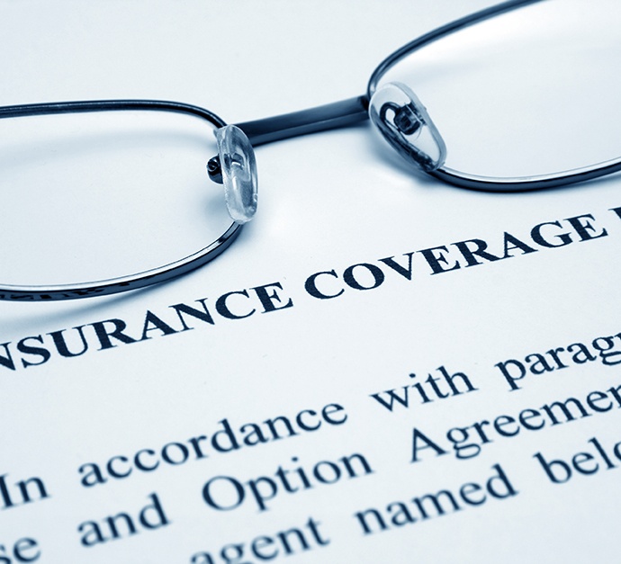 Patient filling out dental insurance form